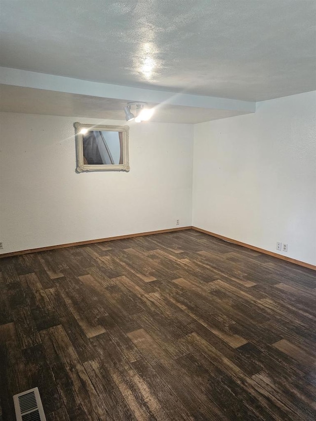 301 Superior St, Boscobel, WI 53805 - empty room with dark wood-style flooring and baseboards