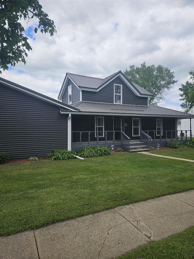 301 Superior St, Boscobel, WI 53805 - country-style home featuring a front yard, metal roof, and a porch