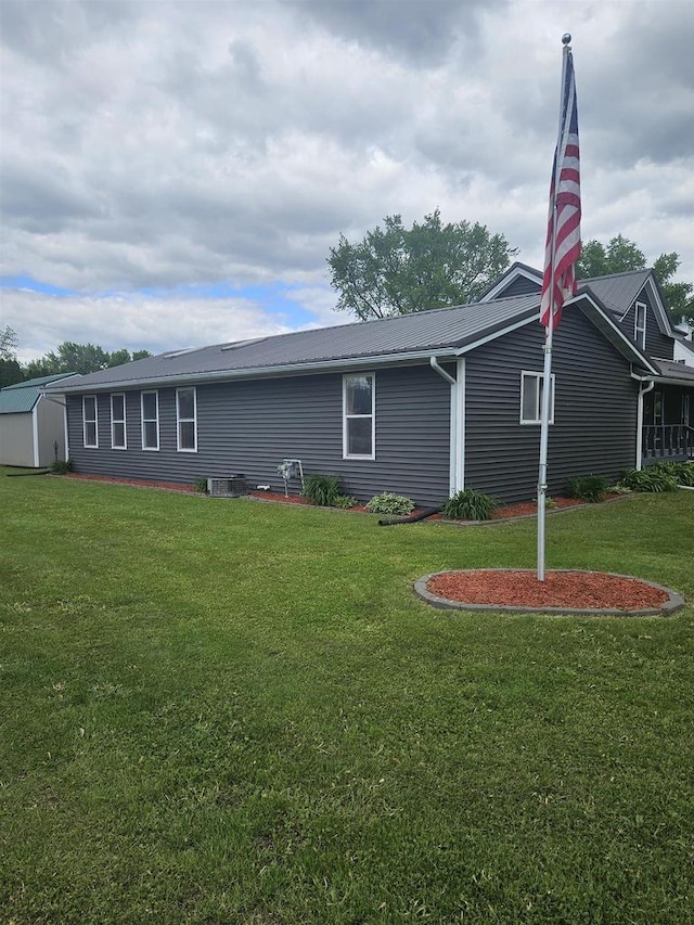 301 Superior St, Boscobel, WI 53805 - view of side of property with a yard and metal roof