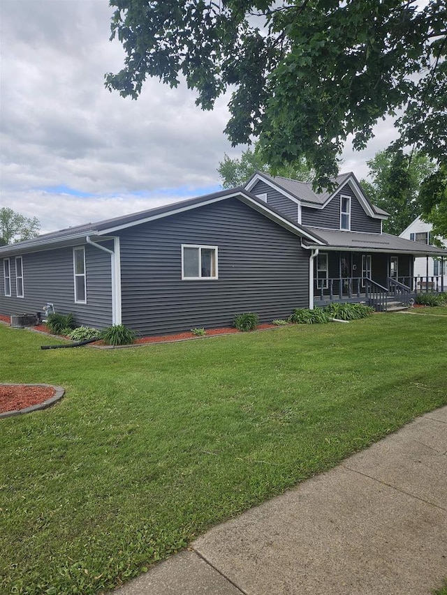 301 Superior St, Boscobel, WI 53805 - view of side of property with covered porch and a lawn