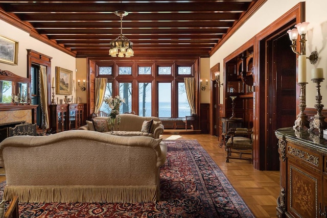 3432 N Lake Dr, Milwaukee, WI 53211 - living room featuring a chandelier, a wainscoted wall, and healthy amount of natural light