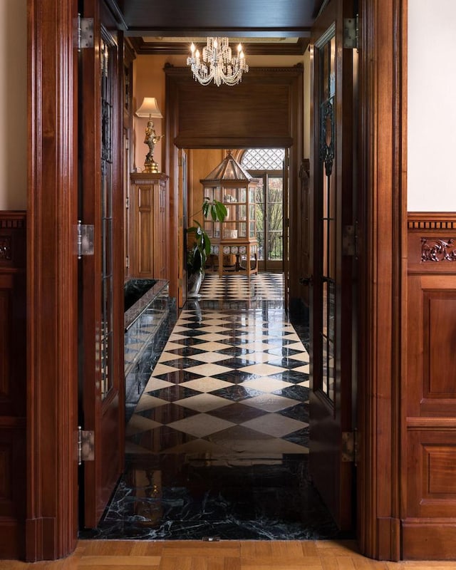 3432 N Lake Dr, Milwaukee, WI 53211 - hallway with a chandelier