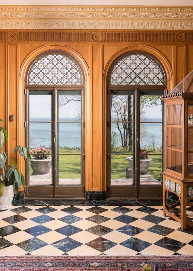 3432 N Lake Dr, Milwaukee, WI 53211 - entryway featuring a water view, plenty of natural light, and tile patterned floors