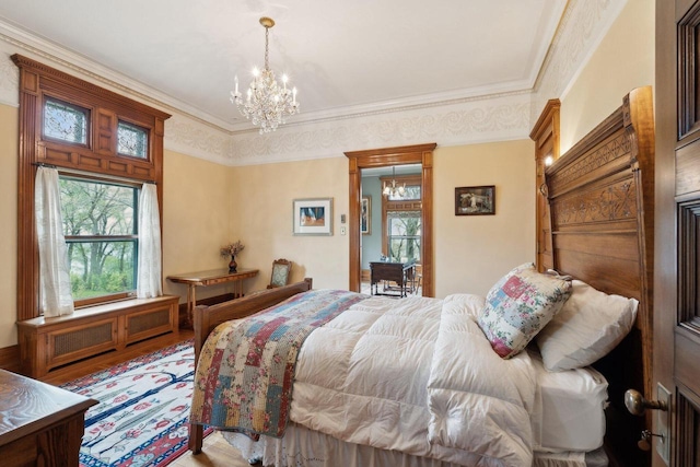 3432 N Lake Dr, Milwaukee, WI 53211 - bedroom with a chandelier, wood finished floors, and crown molding