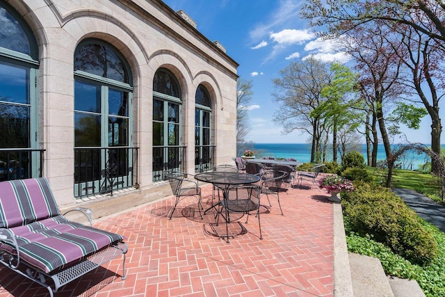 3432 N Lake Dr, Milwaukee, WI 53211 - view of patio featuring a water view and outdoor dining area