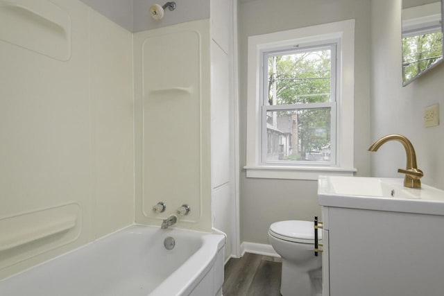 244 S Ridge St, Hustisford, WI 53034 - full bathroom featuring vanity, toilet, baseboards, wood finished floors, and shower / bathtub combination