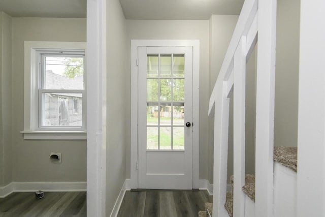 244 S Ridge St, Hustisford, WI 53034 - doorway to outside with dark wood-style floors, healthy amount of natural light, and baseboards