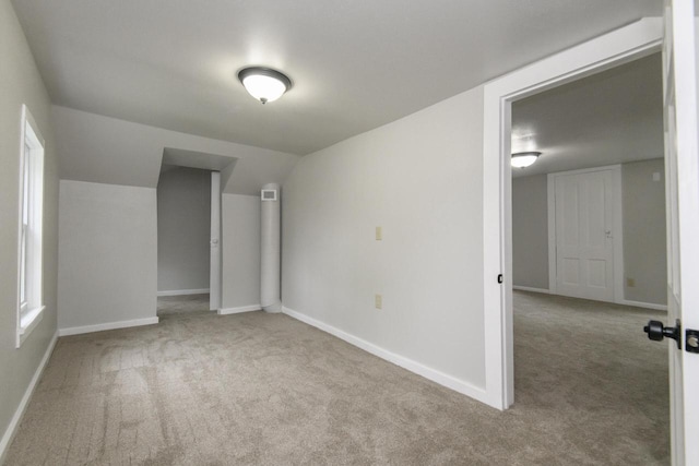 244 S Ridge St, Hustisford, WI 53034 - unfurnished room featuring carpet, baseboards, and vaulted ceiling