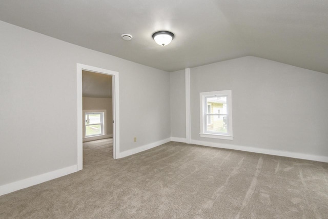 244 S Ridge St, Hustisford, WI 53034 - additional living space with carpet, vaulted ceiling, and baseboards