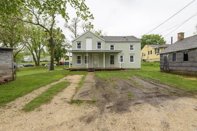 244 S Ridge St, Hustisford, WI 53034 - back of property featuring covered porch and a yard