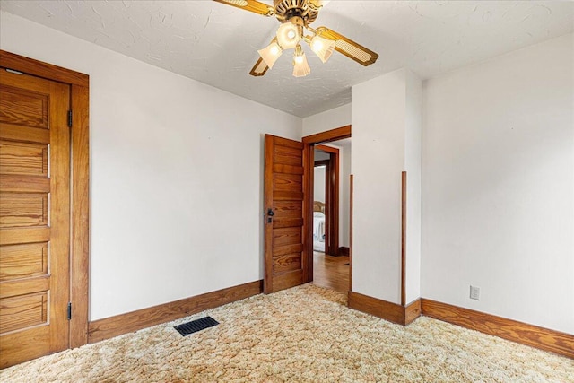 611 Highland Ave, Kewaskum, WI 53040 - unfurnished bedroom featuring baseboards, carpet floors, and a ceiling fan