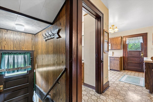 611 Highland Ave, Kewaskum, WI 53040 - hallway featuring wood walls and an upstairs landing