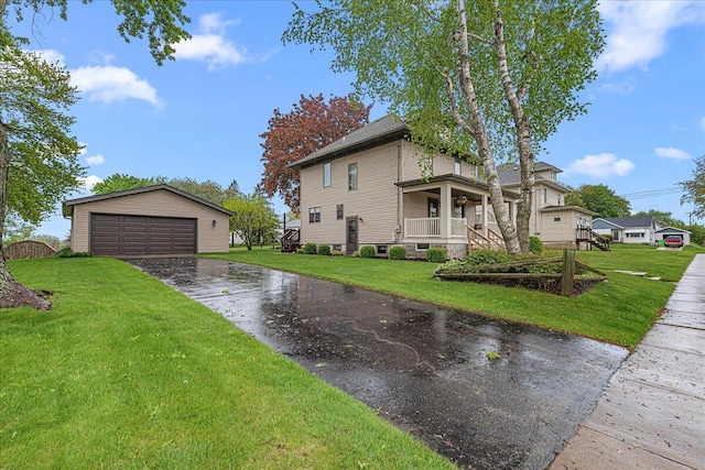 611 Highland Ave, Kewaskum, WI 53040 - view of side of home with an outdoor structure, a detached garage, and a lawn