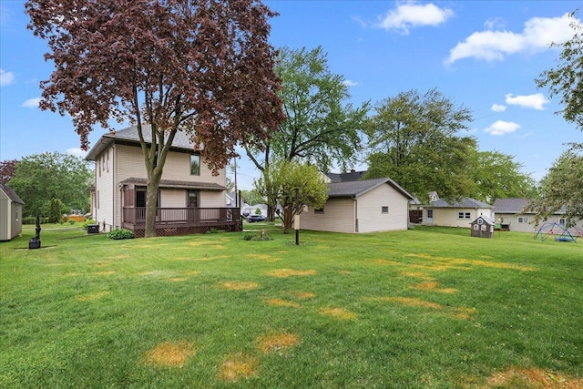 611 Highland Ave, Kewaskum, WI 53040 - view of green lawn with a deck