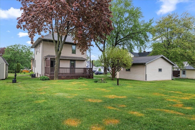 611 Highland Ave, Kewaskum, WI 53040 - view of green lawn featuring a wooden deck and cooling unit