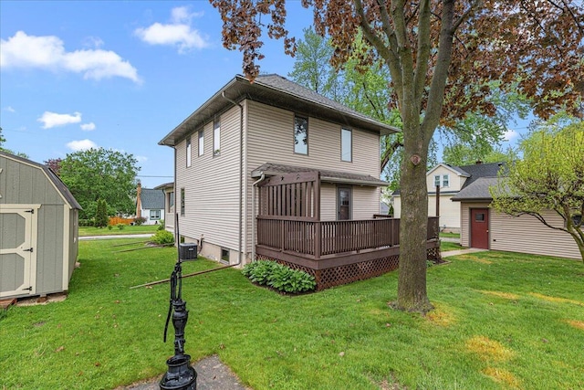 611 Highland Ave, Kewaskum, WI 53040 - back of house featuring a wooden deck, a yard, and central AC unit