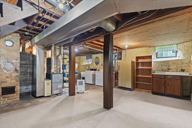 611 Highland Ave, Kewaskum, WI 53040 - below grade area featuring freestanding refrigerator, separate washer and dryer, and light carpet