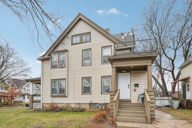 2202 N 55th St, Milwaukee, WI 53208 - american foursquare style home with a front yard and a chimney
