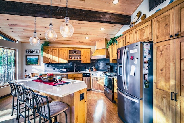 12711 Wind Point Rd, Manitowish Waters, WI 54545 - kitchen featuring appliances with stainless steel finishes, light wood finished floors, open shelves, light countertops, and a breakfast bar