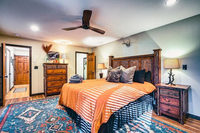 12711 Wind Point Rd, Manitowish Waters, WI 54545 - bedroom with wood finished floors, baseboards, recessed lighting, and ceiling fan