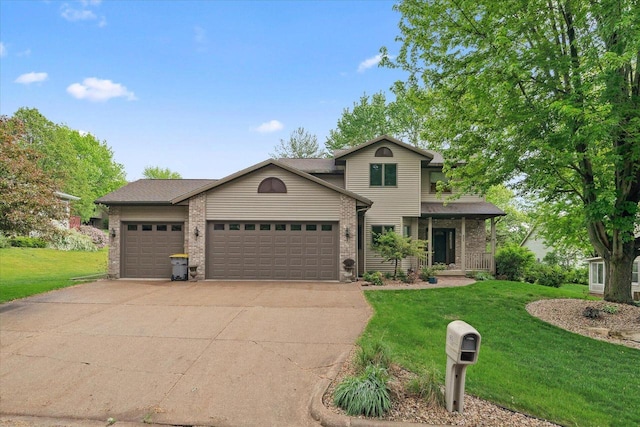 405 August Hills Dr, La Crescent, MN 55947 - traditional-style home with a front lawn, an attached garage, concrete driveway, and a porch