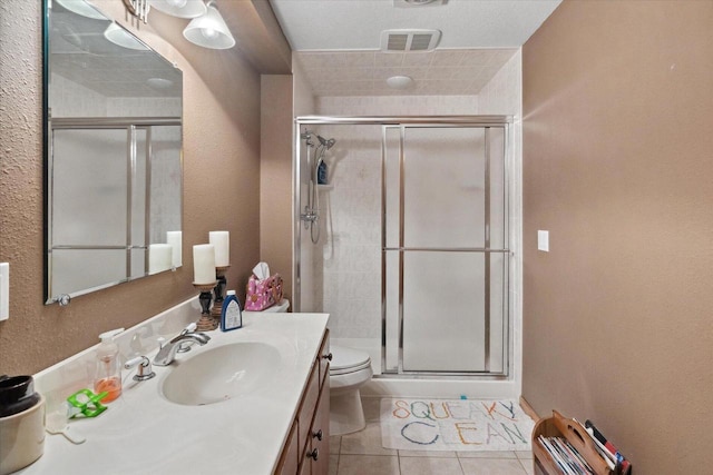405 August Hills Dr, La Crescent, MN 55947 - bathroom with vanity, a shower stall, toilet, and tile patterned flooring