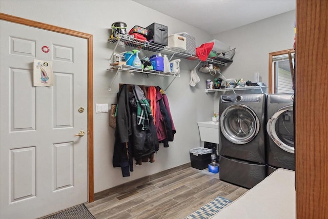 405 August Hills Dr, La Crescent, MN 55947 - laundry room with washer and clothes dryer and wood finished floors