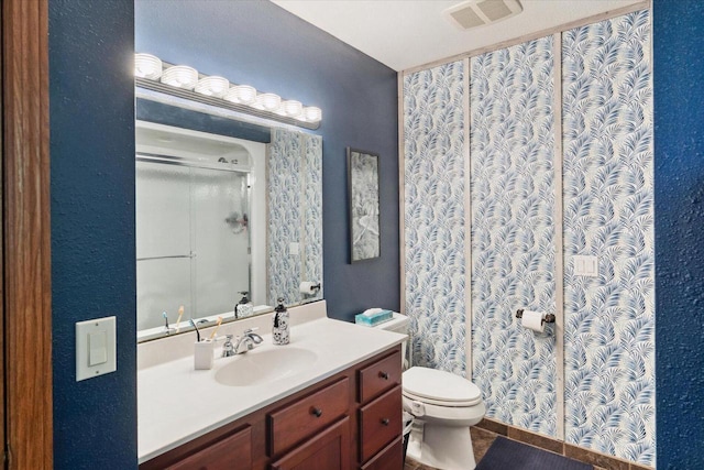 405 August Hills Dr, La Crescent, MN 55947 - full bathroom featuring vanity, an enclosed shower, and toilet
