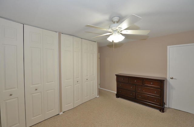 12100 44th Ave, Pleasant Prairie, WI 53158 - bedroom featuring two closets, light carpet, and a ceiling fan