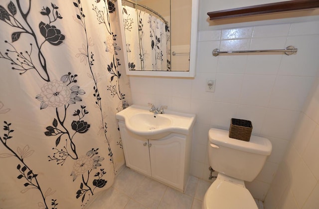12100 44th Ave, Pleasant Prairie, WI 53158 - bathroom with vanity, toilet, tile patterned floors, a shower with curtain, and tile walls