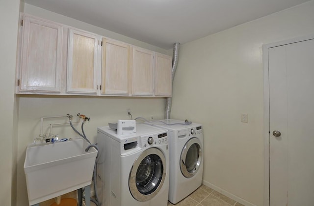 12100 44th Ave, Pleasant Prairie, WI 53158 - laundry room with cabinet space, independent washer and dryer, baseboards, and light tile patterned floors