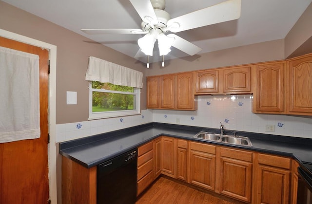 12100 44th Ave, Pleasant Prairie, WI 53158 - kitchen with black dishwasher, a sink, decorative backsplash, and dark countertops