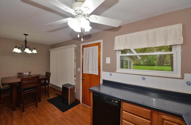 12100 44th Ave, Pleasant Prairie, WI 53158 - kitchen featuring dishwasher, dark countertops, wood finished floors, decorative backsplash, and a chandelier