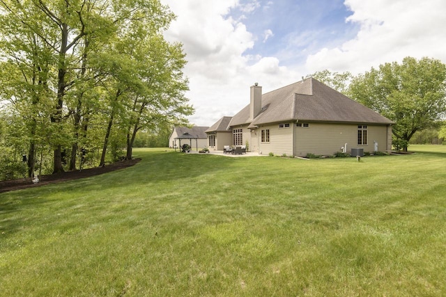 W360S9910 Markham Rd, Eagle, WI 53119 - view of grassy yard with a patio area and central AC