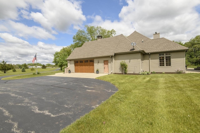 W360S9910 Markham Rd, Eagle, WI 53119 - view of front of property with asphalt driveway, a garage, a chimney, and a front lawn