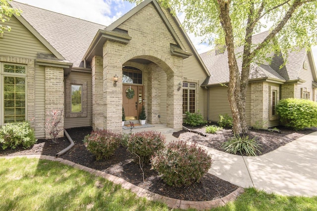 W360S9910 Markham Rd, Eagle, WI 53119 - view of front facade with brick siding and a shingled roof