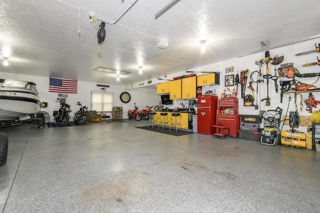W360S9910 Markham Rd, Eagle, WI 53119 - garage with a workshop area