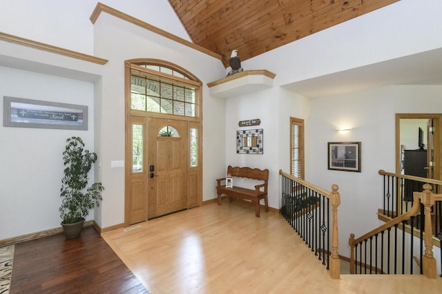 W360S9910 Markham Rd, Eagle, WI 53119 - entrance foyer featuring high vaulted ceiling, wood finished floors, and baseboards