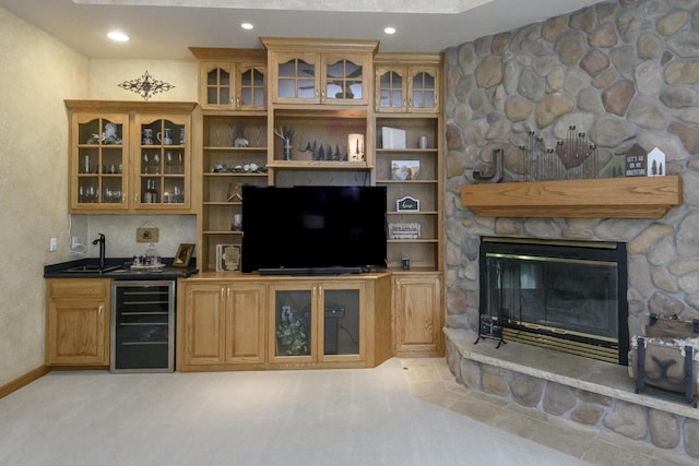 W360S9910 Markham Rd, Eagle, WI 53119 - living room featuring wine cooler, wet bar, a fireplace, recessed lighting, and light colored carpet
