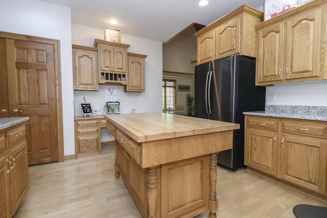 W360S9910 Markham Rd, Eagle, WI 53119 - kitchen with freestanding refrigerator, wooden counters, light wood finished floors, recessed lighting, and a kitchen island