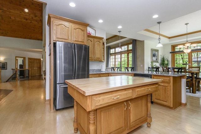 W360S9910 Markham Rd, Eagle, WI 53119 - kitchen with freestanding refrigerator, wooden counters, a kitchen island, a peninsula, and light wood-type flooring