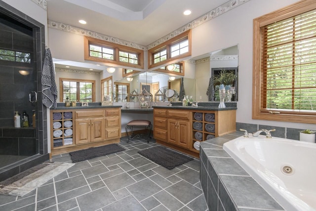 W360S9910 Markham Rd, Eagle, WI 53119 - full bathroom featuring vanity, a stall shower, a jetted tub, recessed lighting, and a towering ceiling