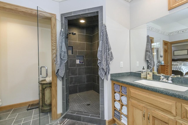 W360S9910 Markham Rd, Eagle, WI 53119 - full bath featuring vanity, a shower stall, tile patterned flooring, and baseboards