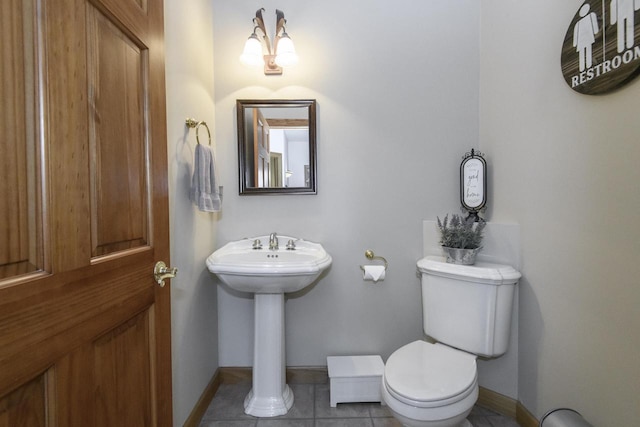W360S9910 Markham Rd, Eagle, WI 53119 - half bathroom featuring toilet, baseboards, and tile patterned floors