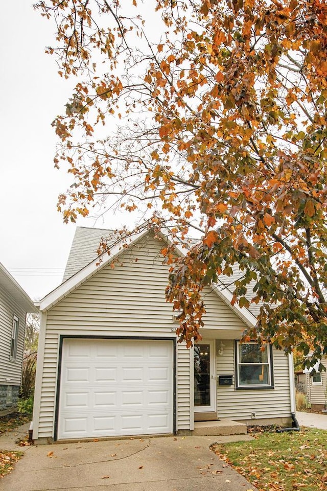 2373 S 83rd St, West Allis, WI 53219 - view of front of house with driveway and a garage