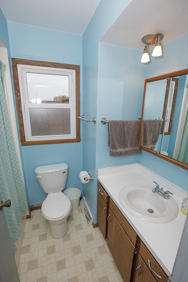 2373 S 83rd St, West Allis, WI 53219 - bathroom with toilet, vanity, baseboards, and tile patterned floors