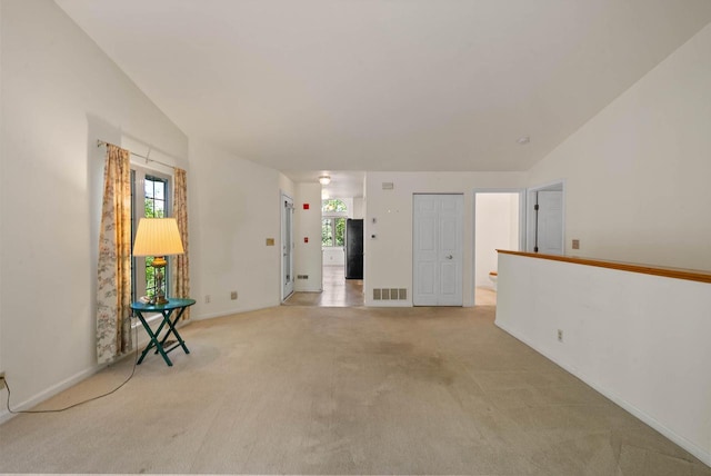 500 S Edwards Blvd Unit 1, Lake Geneva, WI 53147 - spare room with healthy amount of natural light, light colored carpet, and baseboards