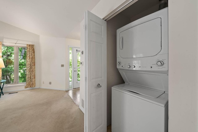 500 S Edwards Blvd Unit 1, Lake Geneva, WI 53147 - washroom with stacked washing machine and dryer, carpet flooring, and baseboards