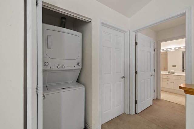 500 S Edwards Blvd Unit 1, Lake Geneva, WI 53147 - laundry room with stacked washer / drying machine and light colored carpet