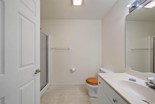 500 S Edwards Blvd Unit 1, Lake Geneva, WI 53147 - full bathroom with toilet, vanity, baseboards, a shower with door, and tile patterned floors